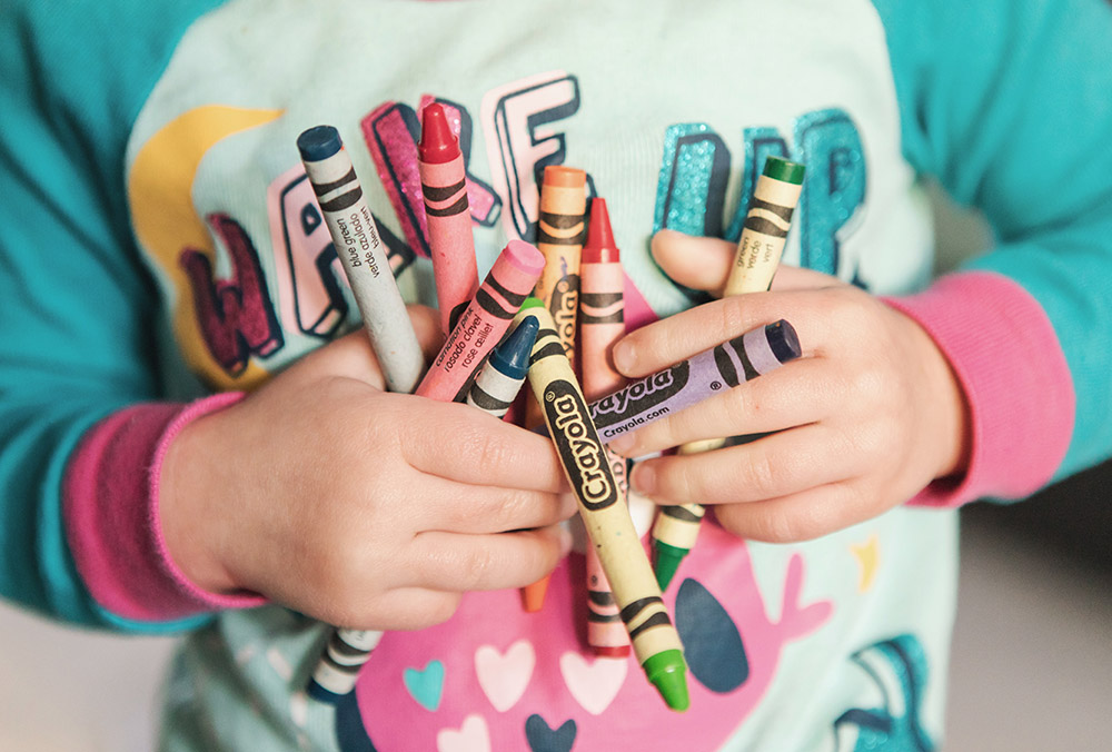 Child with crayons at the Child Care Center, Seymour, Indiana